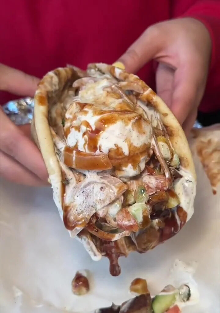 This NYC Halal Spot Is Serving Up A Mountain Of Meat That Will Leave You Speechless