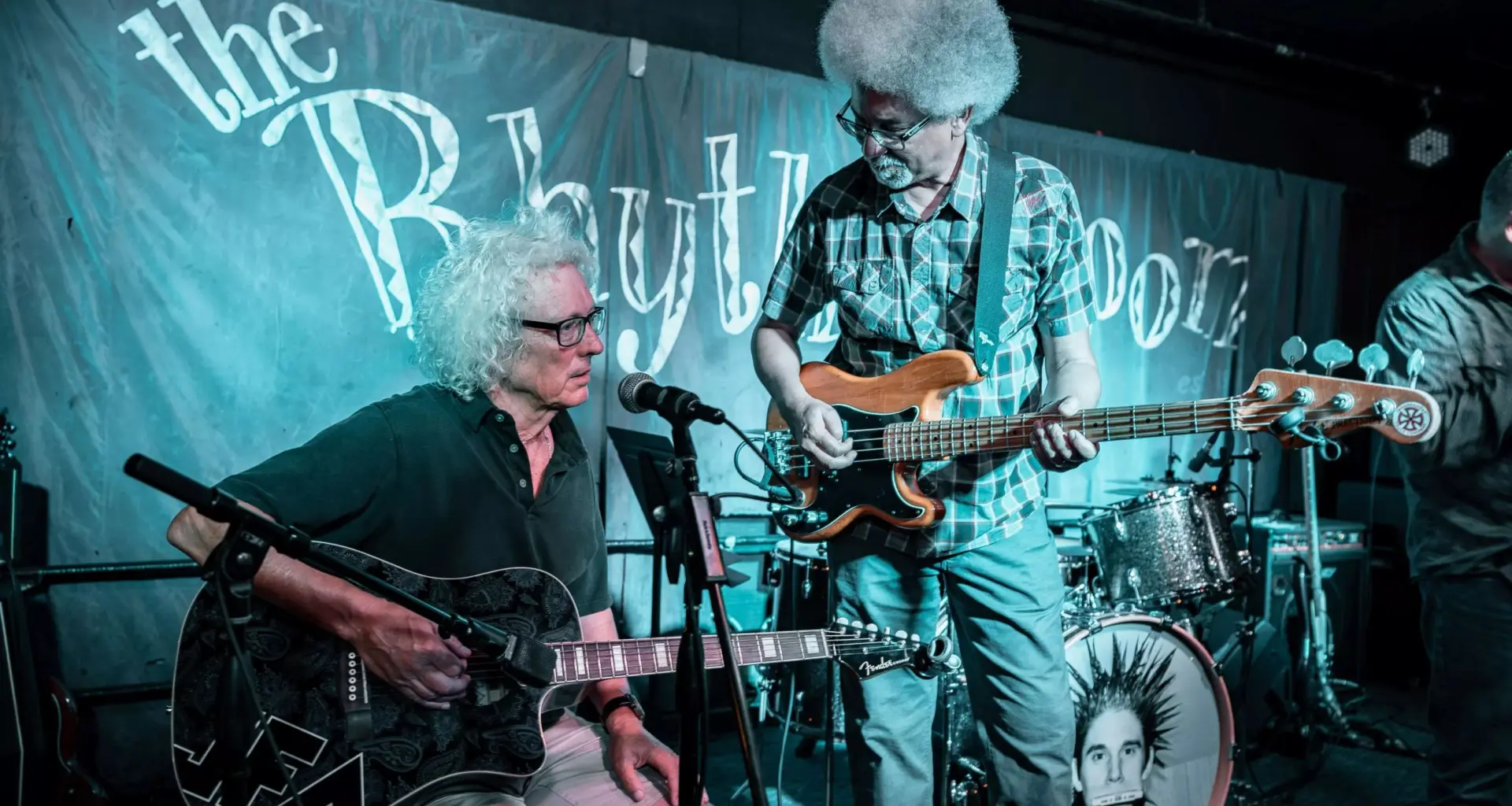 Two guitarists performing.