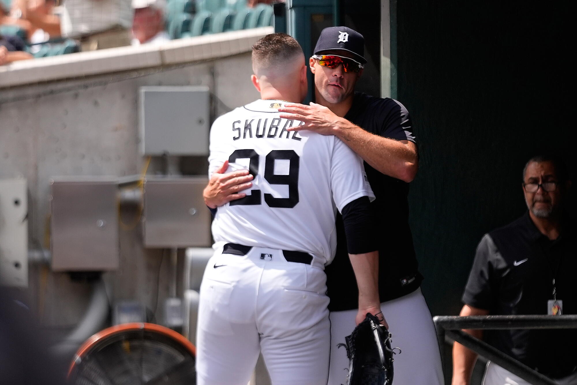 Tarik Skubal (29) hugs Jack Flaherty in the dugout after getting pulled from his last start with the Tigers on July 29.