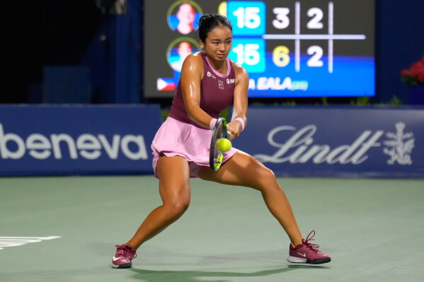 Philippines' Alexandra Eala hits a return to United States' Caty McNally during a National Bank Open tennis match in Toronto on Friday, Aug. 7, 2026. (Chris Young/The Canadian Press via AP)