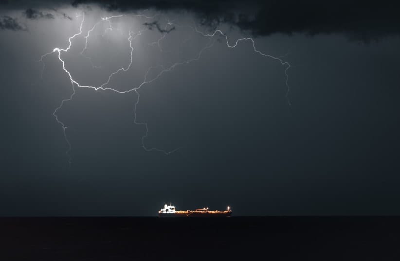 Lightning occurs when META 4, an Oil Products Tanker, sails into Muscat Anchorage on March 21, 2026 at Sultan Qaboos Port in Muscat, Oman.President Donald Trump had threatened to attack Iran's energy infrastructure if it did not end its de facto blockade of the Strait of Hormuz by March 23.