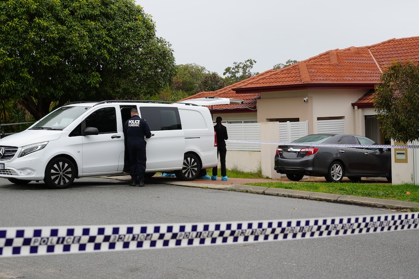 A police van parks outside a residential house.