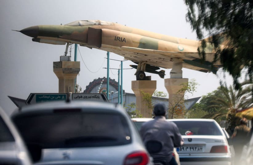 A replica of an Iranian air force F-4 Phantom fighter aircraft is displayed before traffic along a city square in Bandar Abbas in southern Iran on August 10, 2026.