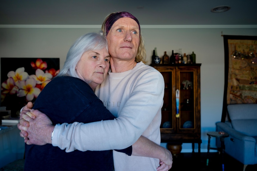 Two people hugging.