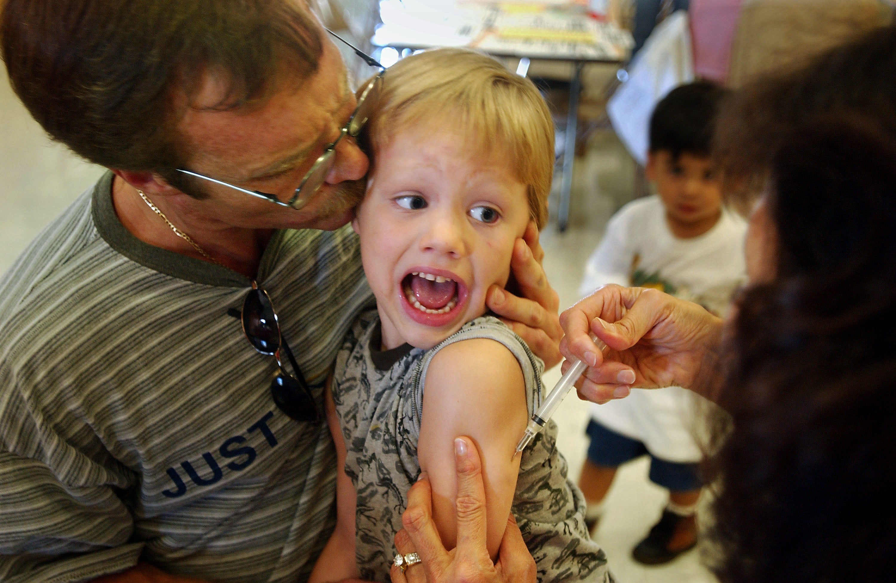 Incoming kindergartener Jeremy Conner, 5, reacts to a measles shot in Santa Ana, California, in August 2002. Measles was declared eliminated in the US in 2000