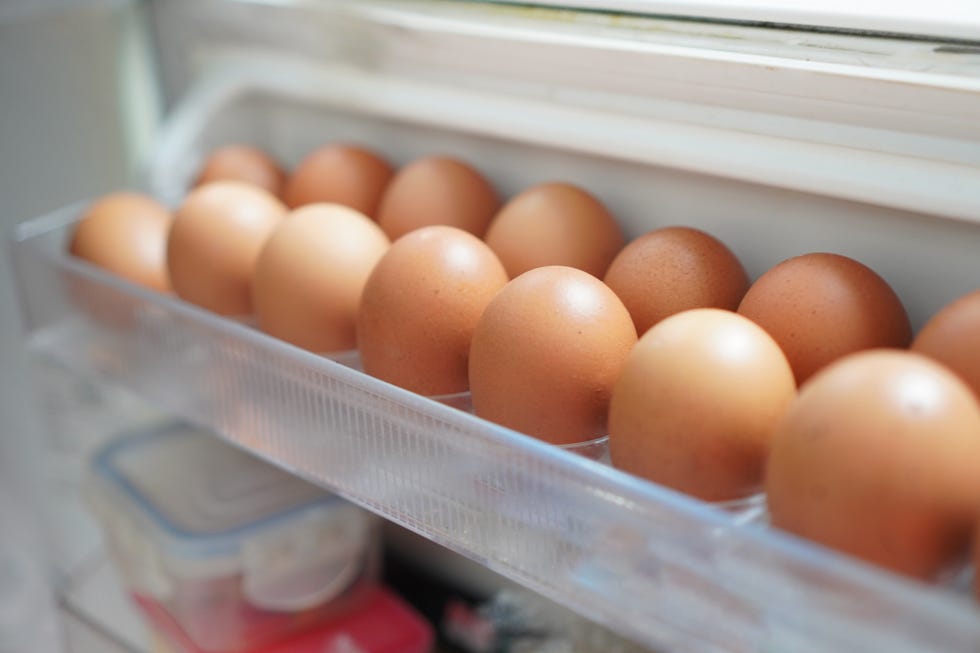 Chicken eggs in the refrigerator panel Chicken eggs in the refrigerator panel