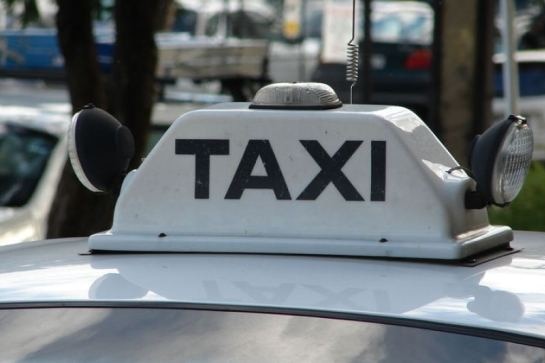 Taxi sign on the roof of a cab