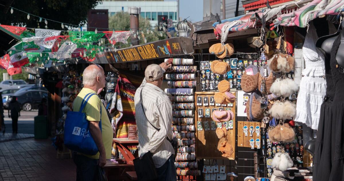 Despite inflation squeeze, Americans keep spending as sentiment climbs