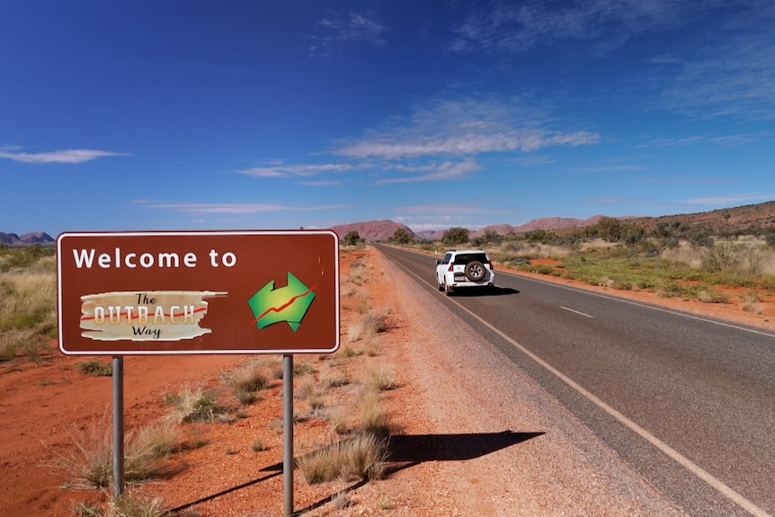 A car on a section of the Outback Way route through central Australia.