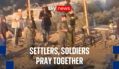 Settlers and soldiers pray outside besieged Palestinian village