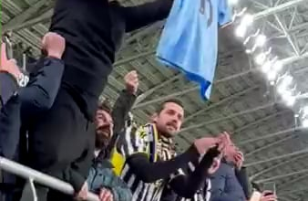 Juventus fans lifting Rodri's shirt in the stands during the Inter - Juventus game to reming them of losing the UEFA Champions League final