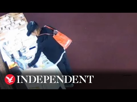 Brazen moment suspect robs church during baptism