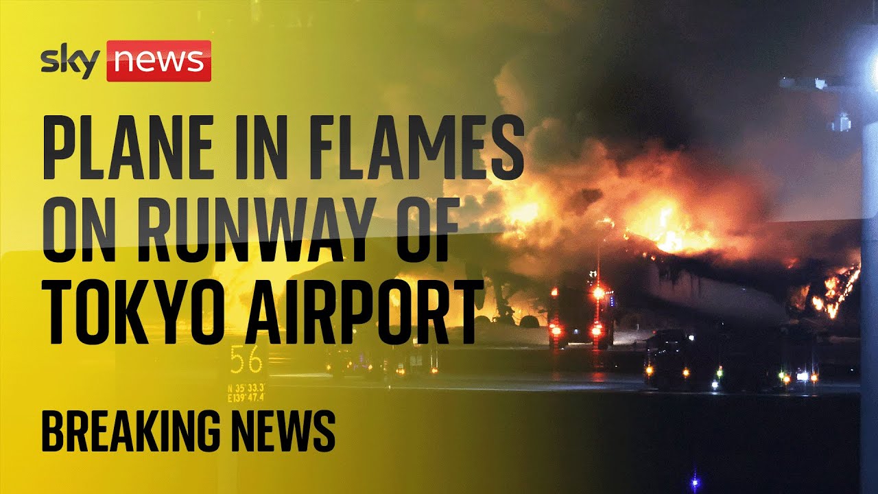 Watch live: Emergency crews respond to plane on fire on runway at Haneda airport in Tokyo