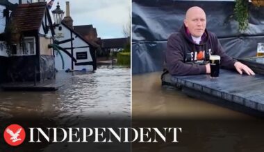 Pub owner drinks pint in waist-deep water during Storm Henk floods