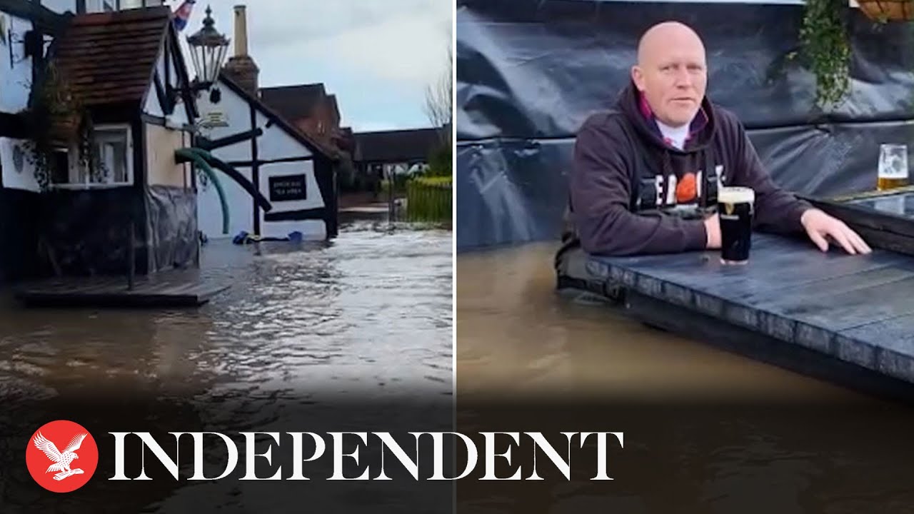 Pub owner drinks pint in waist-deep water during Storm Henk floods