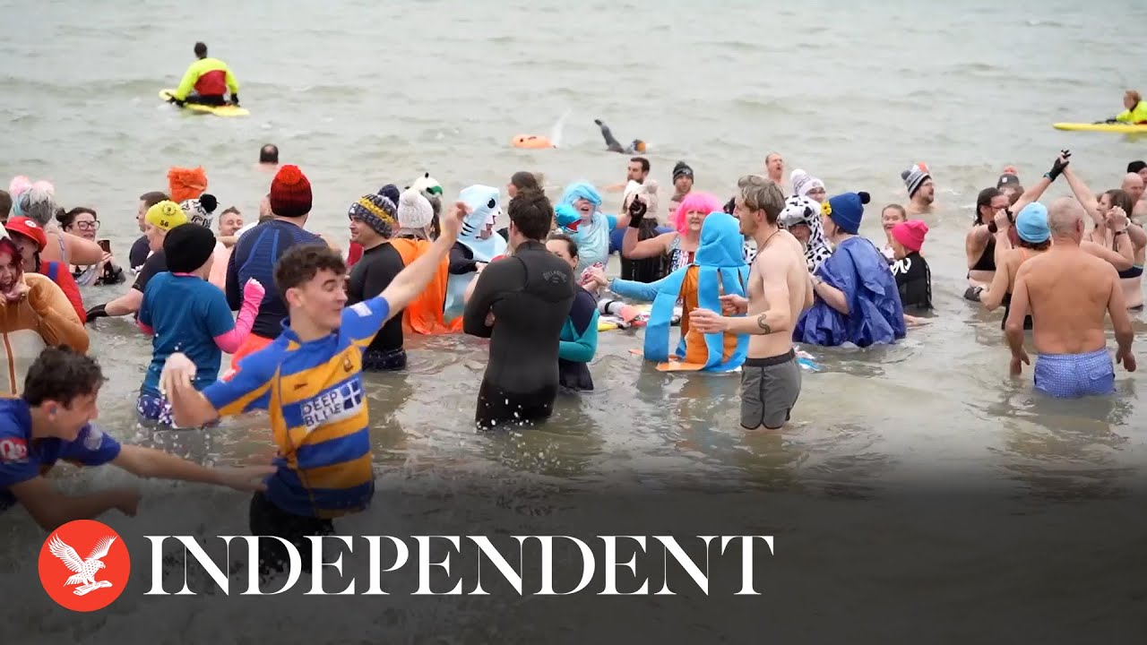 Watch: Hundreds brave icy waters for New Year’s Day dip