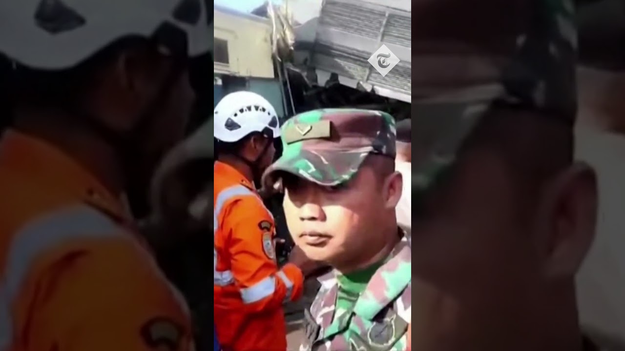 Indonesia train crash: rescuers battle to free survivors