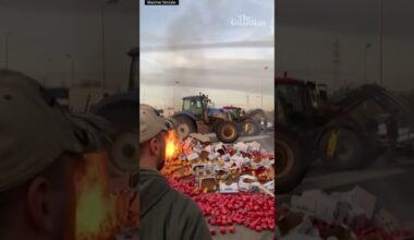 French farmers overturn truck carrying red peppers