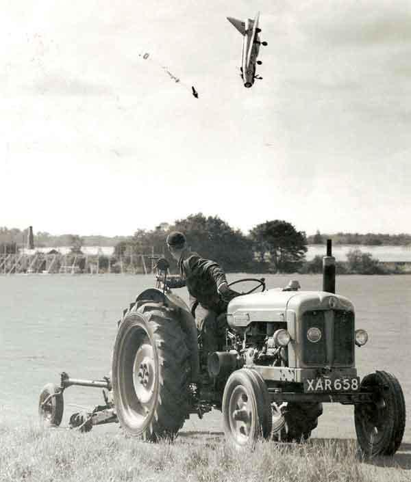 Photo taken on 19th September 1962. The Plane was a Lighting XG332. The pilot ejecting was George Aird. The tractor diver was a 15 year old called Mick Sutterby. Photographer was Jim Meads. The tractor model was . . . . . . ?