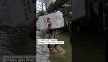 Ballot boxes carried over knee-high floodwater in Jakarta as Indonesia went to the polls