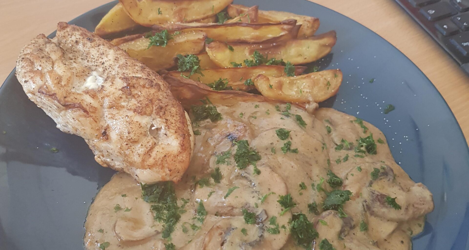 grilled chicken breast, mushroom sauce and potato wedges