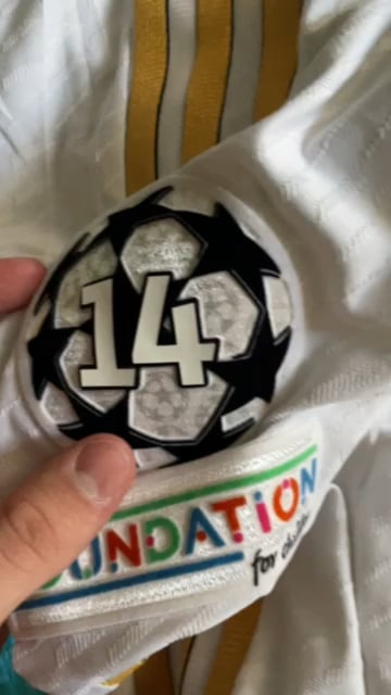 In November I bought a Real Madrid long sleeve shirt from the official store in Barcelona and today I noticed that the numbers on the champions league badge are starting to come off. Do you know how I can fix that?