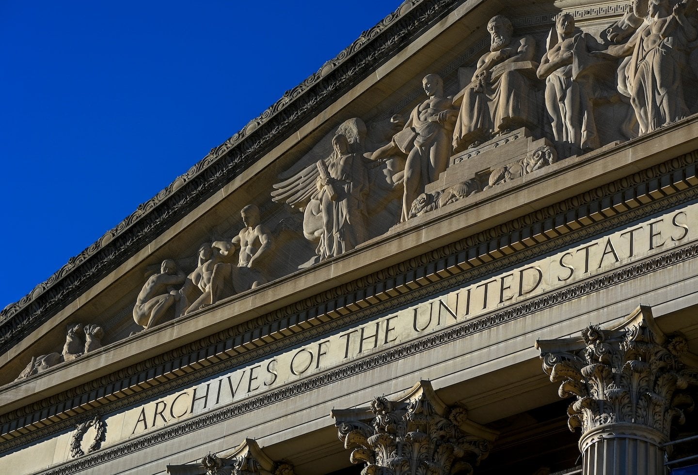 Climate protesters smear powder on case housing U.S. Constitution