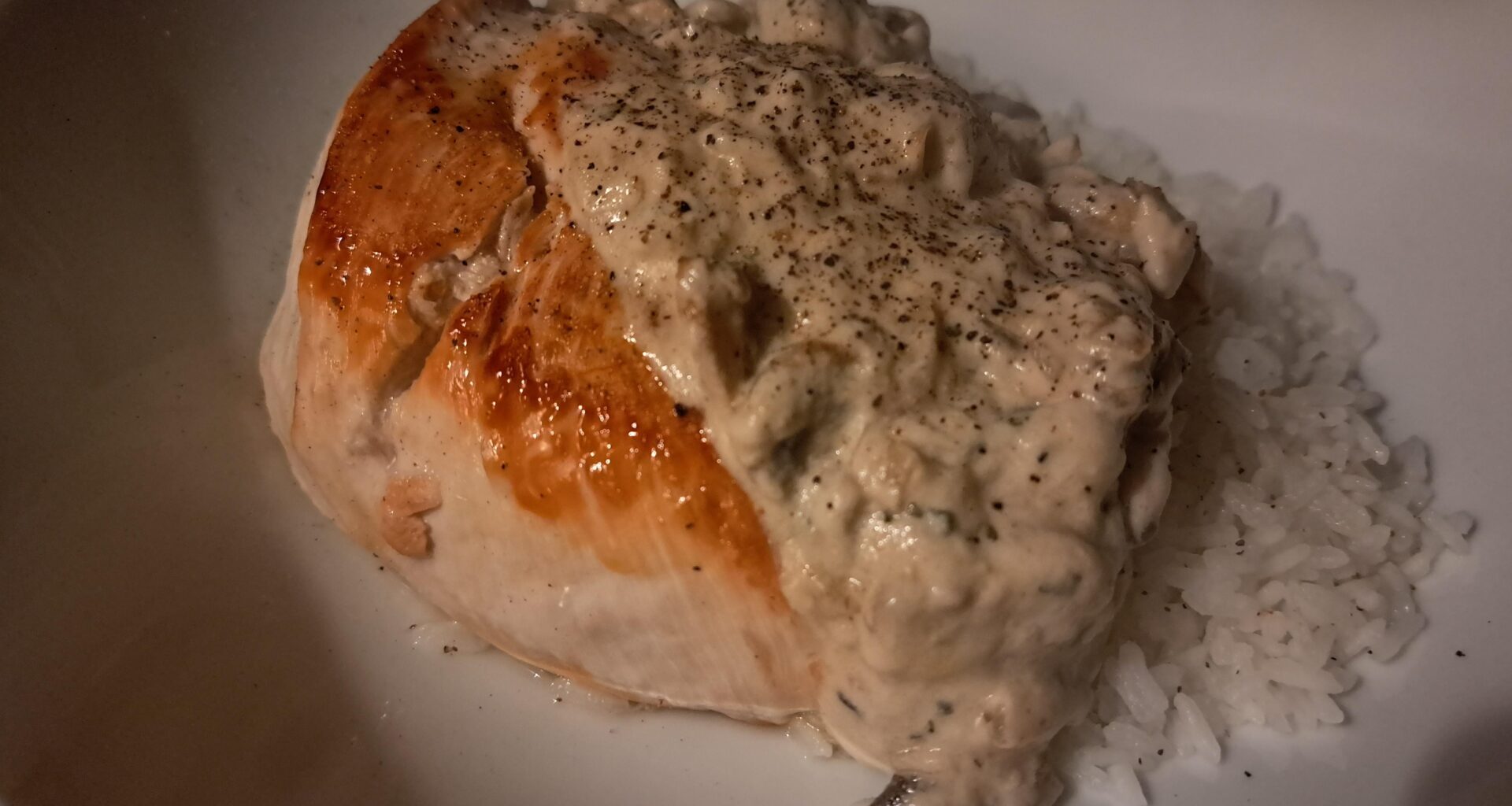 Pan-Fried Chicken Breast with a Tarragon Mushroom Cream Sauce on Rice