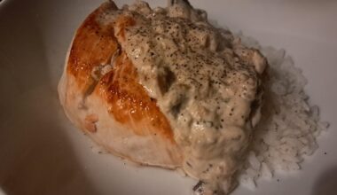 Pan-Fried Chicken Breast with a Tarragon Mushroom Cream Sauce on Rice
