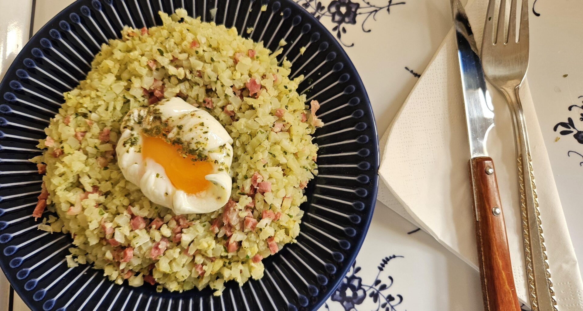 Cauliflower with serrano ham and poached egg