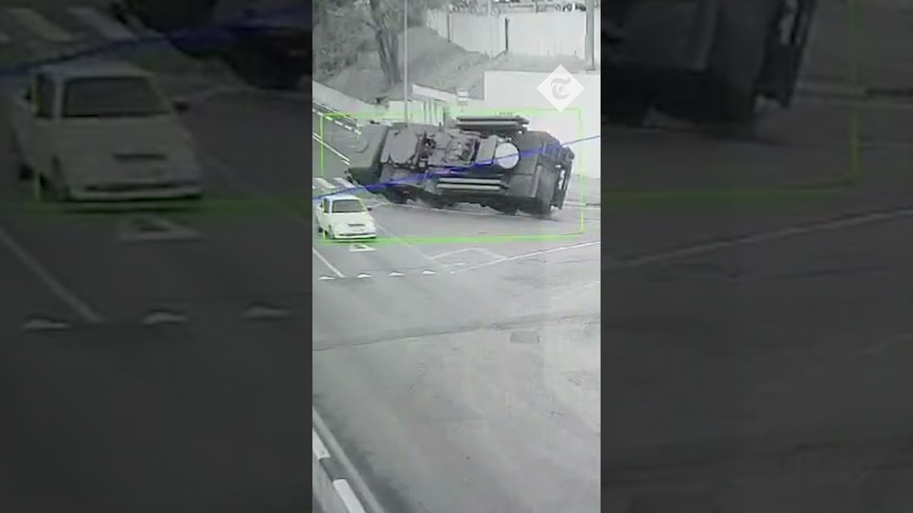 Moment Russian armoured vehicle overturns on a road