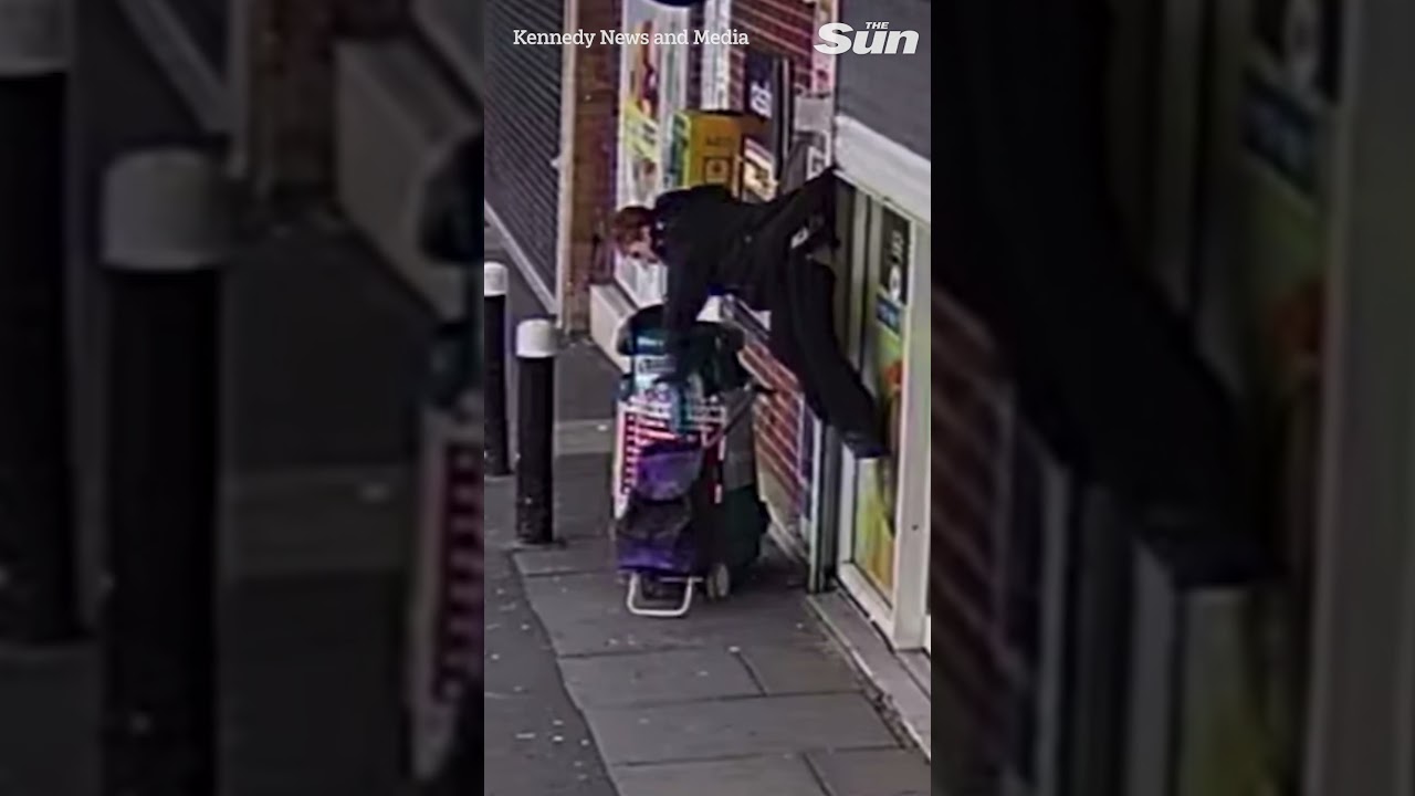 Gran is hoisted into air by coat after getting caught on shop shutter #shorts #thesun