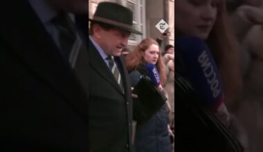 German ambassador ignores reporters as he leaves the Russian foreign ministry