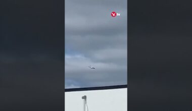 Burning Russian military plane flies over houses #shorts