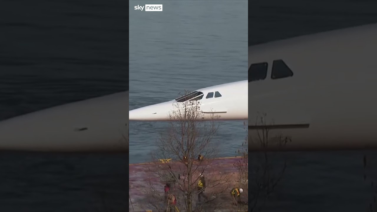Concorde jet floats down Hudson River