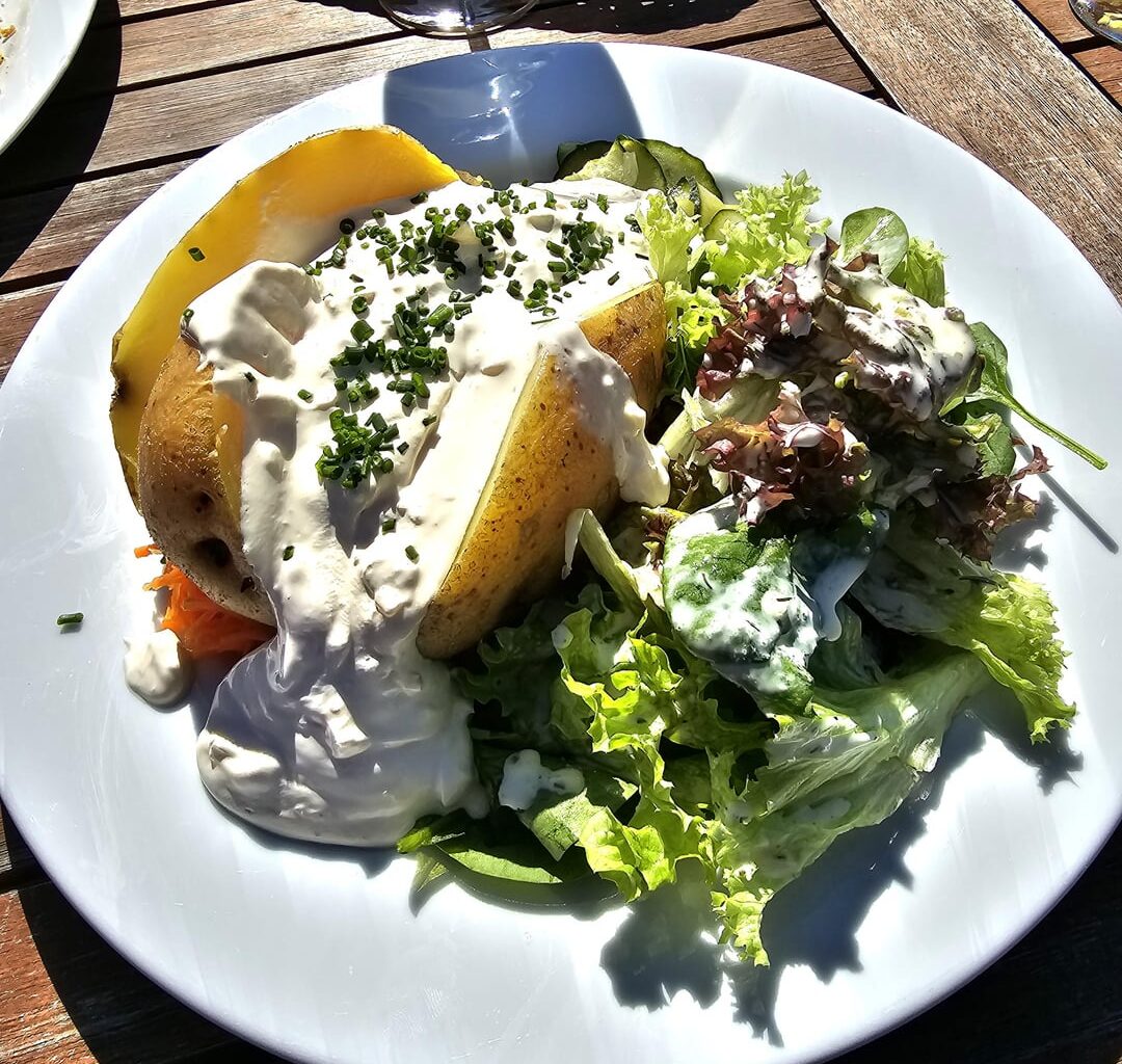 Jacket potato with plenty of dip, along a mixed salad; and spaetzle with a side salad; Reichenau, Lake Constance