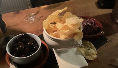 Wine bar tapas - Olives, chips, and saucisson