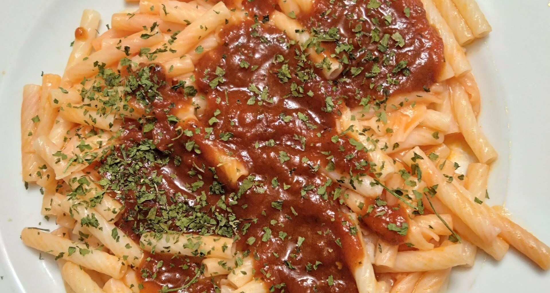 Pasta with tomato-black garlic sauce