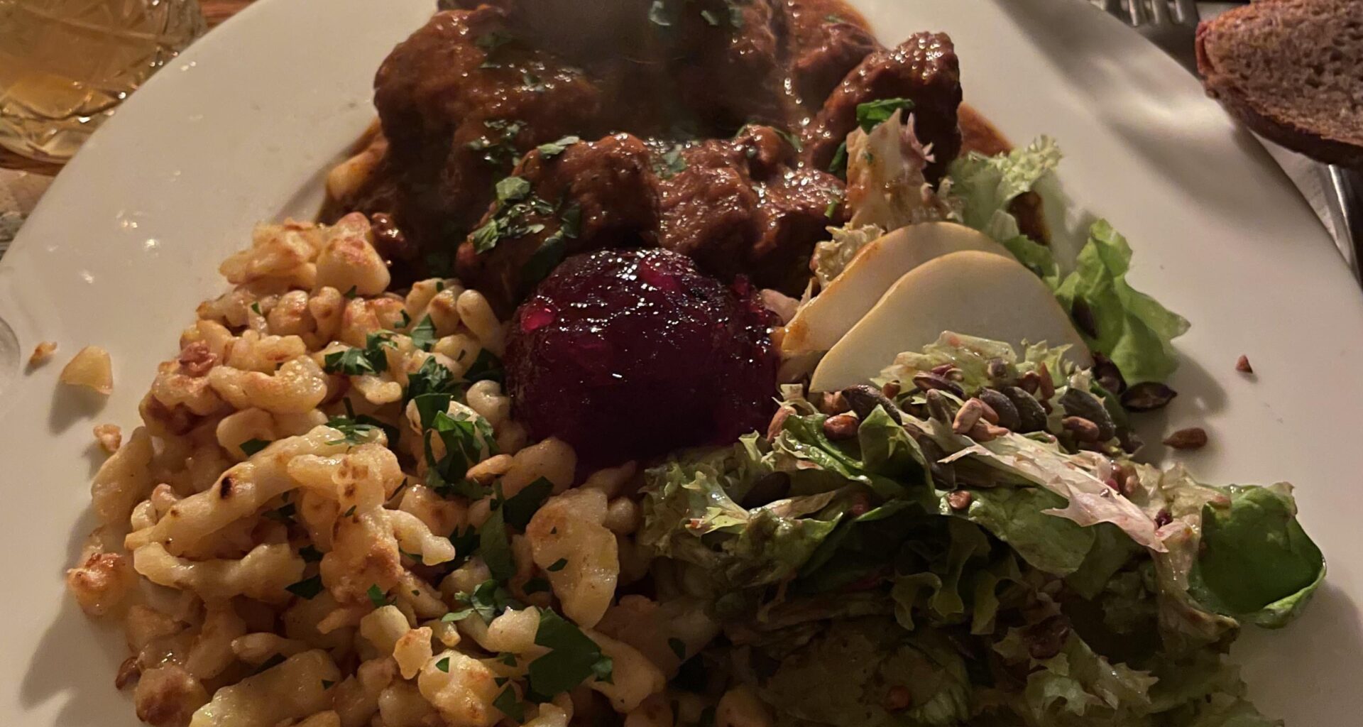 Gulasch, Spätzle, and Salad