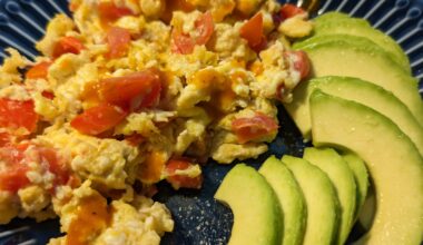 Scrambled eggs with tomatoes and a tad of salsa picante + avocado 🥑