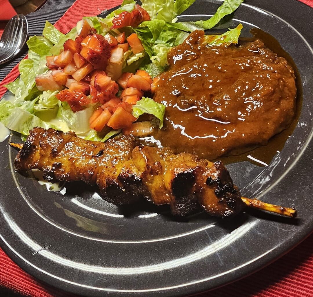 Satay chicken breast with plenty of satay sauce, served with salad and strawberries (instructions in the gallery, read from right to left, needs marinated over night)