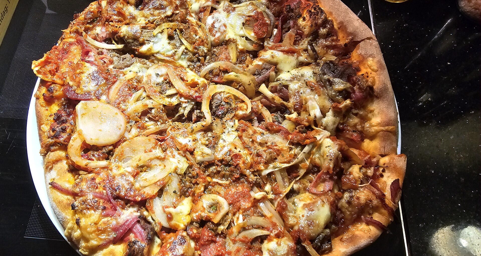 Home made pizza with a bit too much of everything!