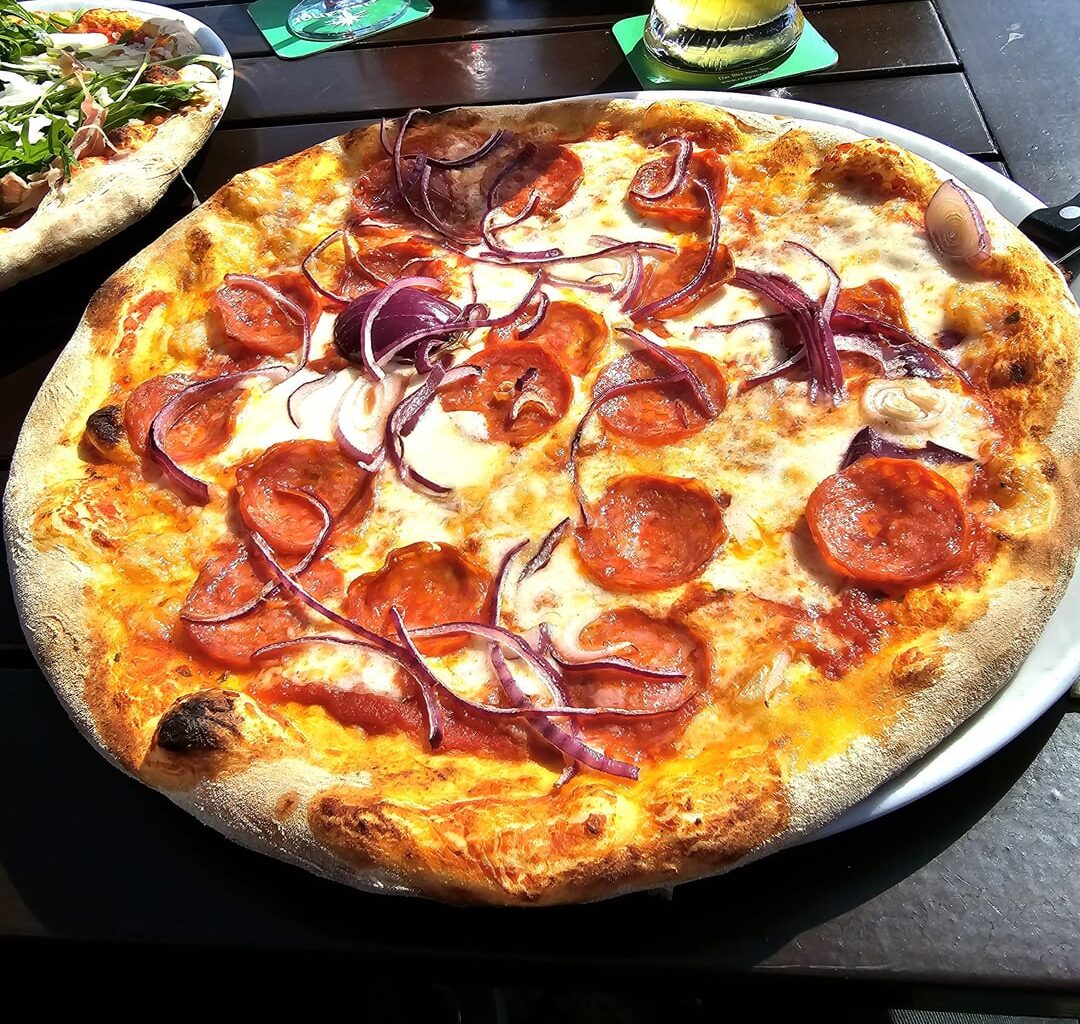 Pizza Siciliana (here: salami, onions, tomatoes, mozzarella, basil), served in the harbour of Constance, Germany ― which pizza for you? (Menu on pic 3)