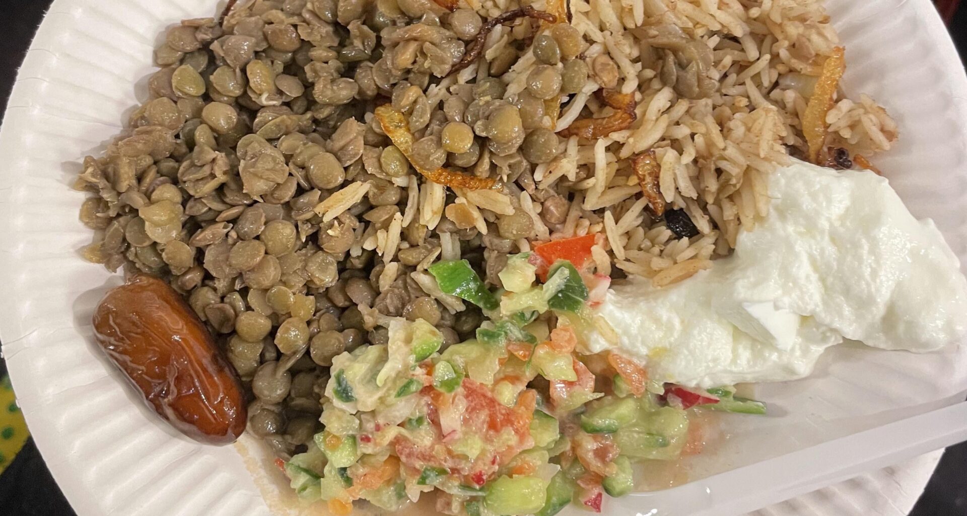 Lentils, rice with onions, salad, and yogurt