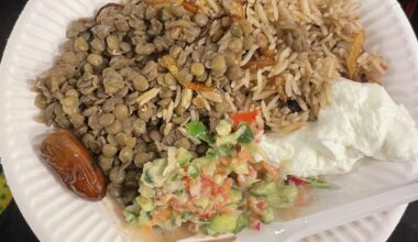 Lentils, rice with onions, salad, and yogurt