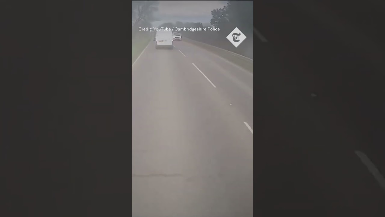 Moment motorist is forced to swerve out of  the way by overtaking van