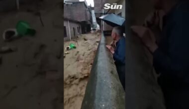 Dramatic moment CAR swept away in seconds during flash flood in China