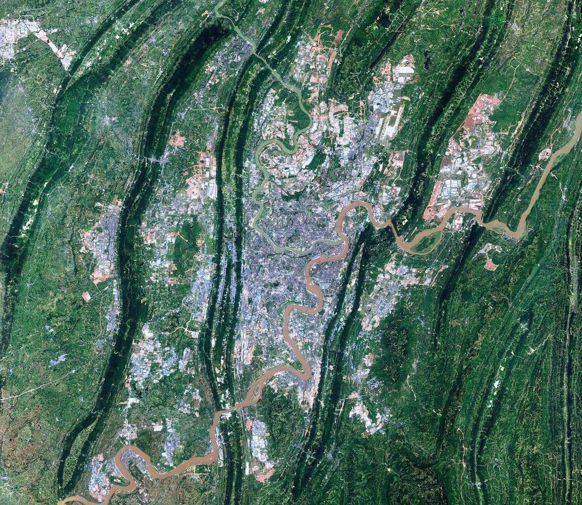Chongqing, China. One of the most populated municipalities in the world. An estimated 30 million people living across 26 districts, eight counties and four autonomous counties. It is equal to the size of Austria - 31,816 square miles (82,403 square km).