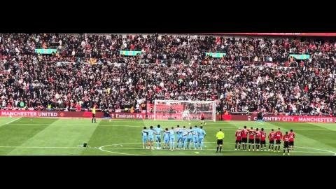 Antony cups his ears towards Coventry players after Man United wins on penalties. Harry Maguire walks across to shake hands with them.