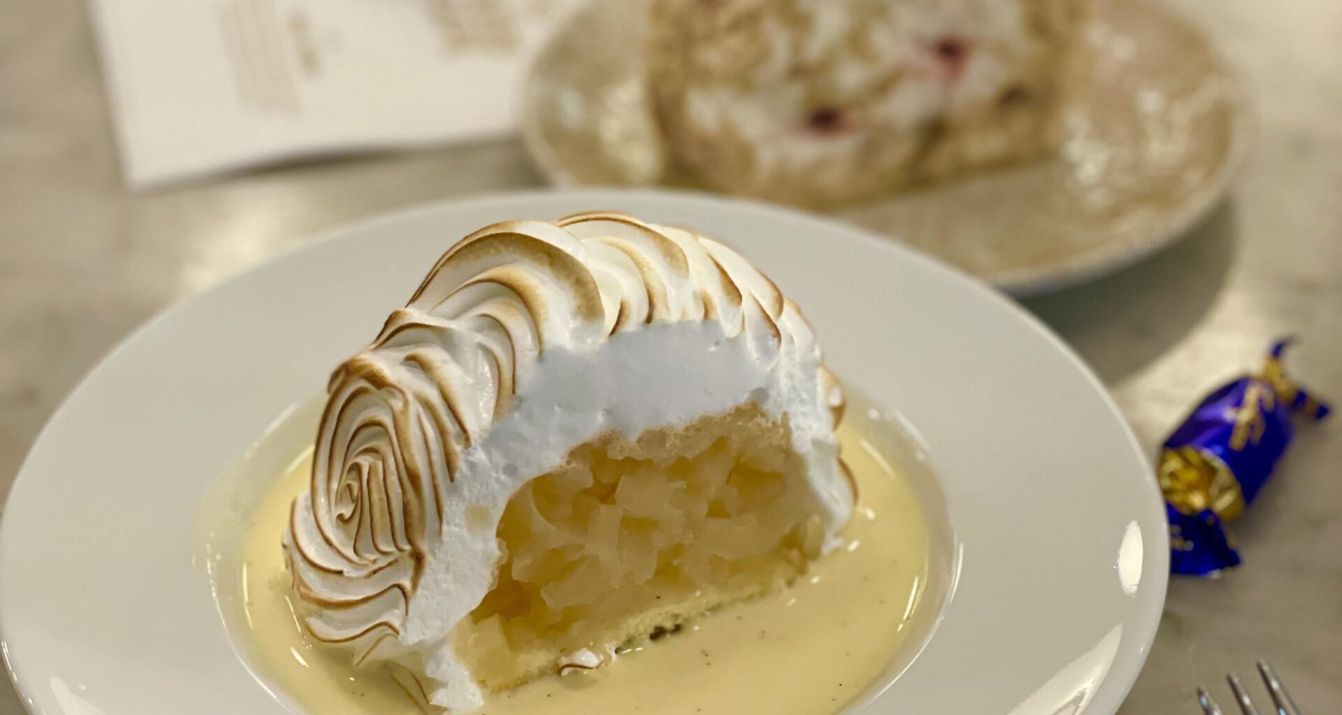Vanilla merengue with apple pie and vanilla sauce in Helsinki